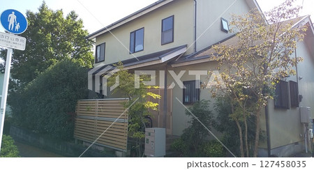 A wooden house surrounded by trees A wooden house surrounded by trees 127458035