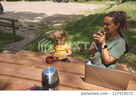 Mother and Child Enjoying Outdoor Work and Play in Nature 127458072