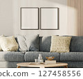 Two blank frames in lounge interior with blue sofa and table with wooden panel on the wall, 3d render 127458556