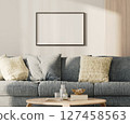 Horizontal blank frame mock-up on a white wall with wooden panel above blue sofa in living room, 3d render 127458563