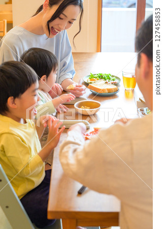 A scene of a family of four eating A scene of a family of four eating 127458853