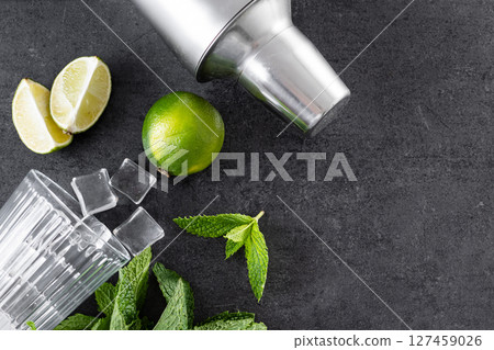 Classic Mojito Cocktail ingredients on black slate background 127459026