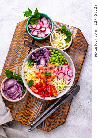 Balanced healthy bowl with vegetables and salmon Balanced healthy bowl with vegetables and salmon 127459125