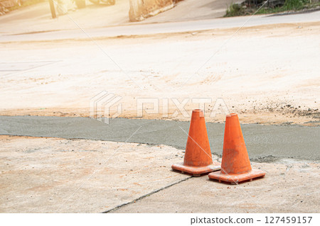 Traffic cones are used to mark areas within construction zones. 127459157