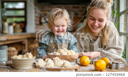Joyful child and woman baking together in a cozy kitchen with flour and fresh ingredients 127459468