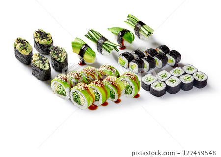 Vegan sushi set with cucumber, avocado and sesame seeds drizzled with soy sauce on white background 127459548