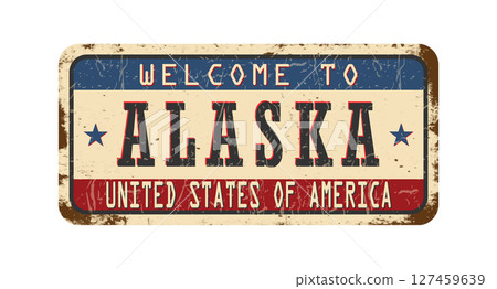 Welcome to Alaska. An old worn sign with an inscription. Welcome metal plaque with rust elements 127459639