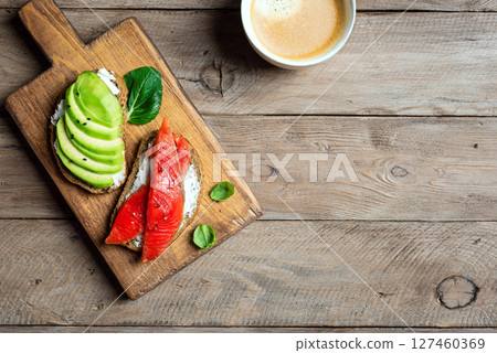 Avocado and salmon open sandwiches Avocado and salmon open sandwiches 127460369