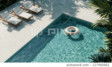 Relaxing Pool Area With Sun Loungers and Inflatable Ring in a Serene Tropical Setting Relaxing Pool Area With Sun Loungers and Inflatable Ring in a Serene Tropical Setting 127460862