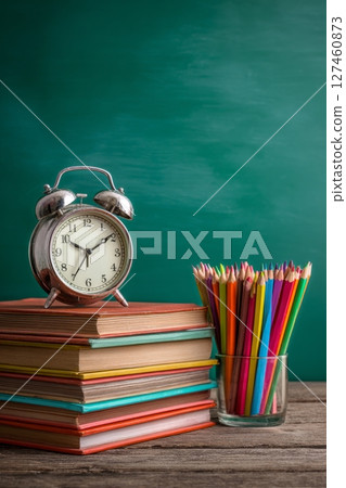 Study Tools Including Alarm Clock and Colored Pencils Enhance Learning Environment. 127460873