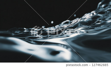 Close-up of smooth fluid organic water surface creating ripples on dark background, viewed from above 127462885