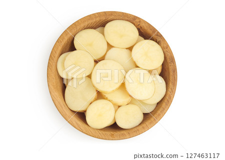 young potato slices in wooden bowl isolated on white background. Harvest new. Top view. Flat lay. 127463117
