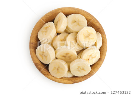 peeled banana pieces in wooden bowl isolated on white background. Top view. Flat lay. peeled banana pieces in wooden bowl isolated on white background. Top view. Flat lay. 127463122