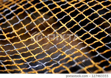 Abstract close up of rusty mesh wire for background Abstract close up of rusty mesh wire for background 127463355