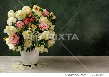 Still life with beautiful rose hips and cream rose flowers in vase on elegant modern table, abstract floral arrangement. template for your design with place for text, minimalist beauty concept, Still life with beautiful rose hips and cream rose flowers in vase on elegant modern table, abstract floral arrangement. template for your design with place for text, minimalist beauty concept, 127463559