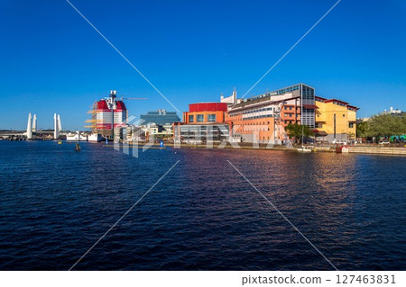 The Gothenburg opera house on the banks of Gota river at Lilla Bommen, Sweden, sunny day The Gothenburg opera house on the banks of Gota river at Lilla Bommen, Sweden, sunny day 127463831
