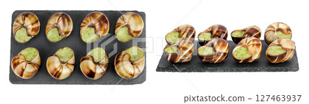 escargot snail filled with garlic and parsley butter on a stone board isolated on white background. Top view. Flat lay escargot snail filled with garlic and parsley butter on a stone board isolated on white background. Top view. Flat lay 127463937