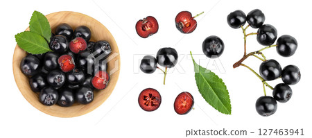 Chokeberry with leaf in a wooden bowl isolated on white background. Black aronia. Top view. Flat lay Chokeberry with leaf in a wooden bowl isolated on white background. Black aronia. Top view. Flat lay 127463941