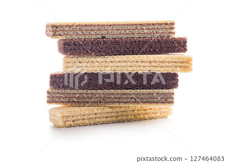 Sweet wafers filled with chocolate and vanilla cream isolated on white background. Sweet wafers filled with chocolate and vanilla cream isolated on white background. 127464083