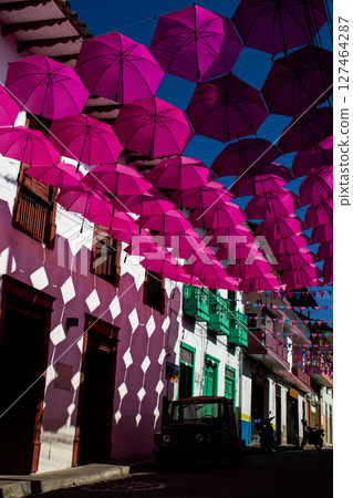 Colorful umbrellas and the beautiful streets of the Heritage Town of Jerico located in the Department of Antioquia in Colombia. 127464287