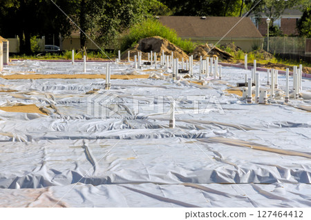 Construction site prepared with sheeting pipes for future building project in sunny weather Construction site prepared with sheeting pipes for future building project in sunny weather 127464412