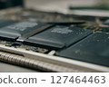 A closeup, detailed view showcasing lithiumion batteries integrated into the intricate internal structure of a laptop 127464463