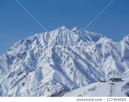 Blue skies and snow in the Northern Alps, Hakuba Village, Nagano Prefecture 127464689