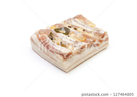 Lard or salo with bay leaf and black peas isolated on white background. 127464805