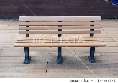 Scenery with a wooden bench on a boardwalk 127465171