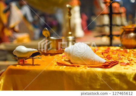 Side view Objects of Aarti ceremony used by Pujaris on Ganges on golden table Side view Objects of Aarti ceremony used by Pujaris on Ganges on golden table 127465612