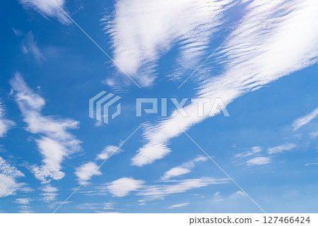 Wave clouds scattered in the blue sky c-1 127466424