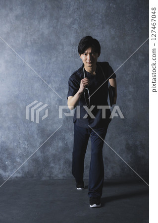 Male doctor and nurse in scrubs Male doctor and nurse in scrubs 127467048