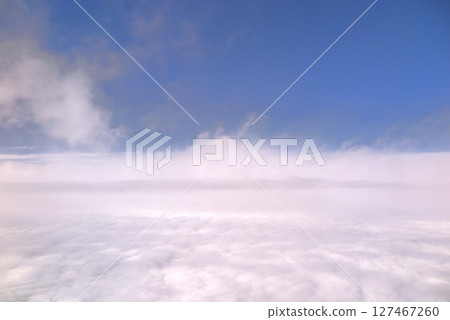 Blue sky covered with a sea of clouds 127467260