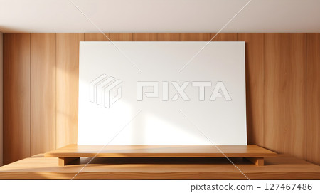 Minimalist interior with a blank white canvas, wood paneling, and a wooden platform. 127467486