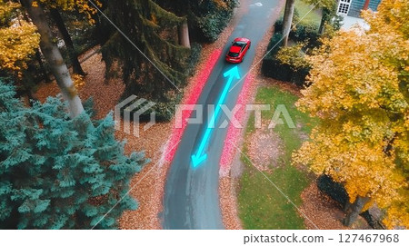 Red Car Navigating Autumn Road with Glowing Blue Arrow Overlay Red Car Navigating Autumn Road with Glowing Blue Arrow Overlay 127467968
