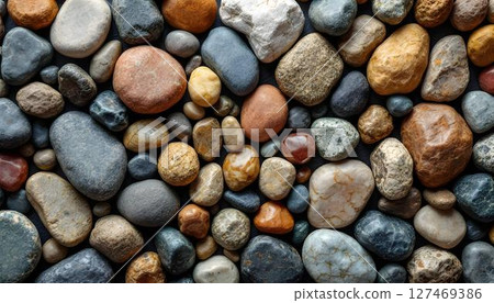 Close-up image of a substantial pile of rocks, emphasizing the intricate patterns and natural variations in the stone surfaces 127469386