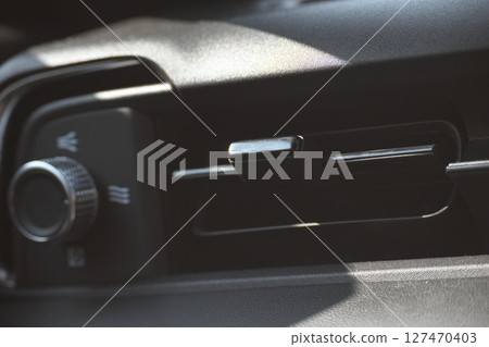 interior view of car with black leather, closeup car air conditional vents interior view of car with black leather, closeup car air conditional vents 127470403