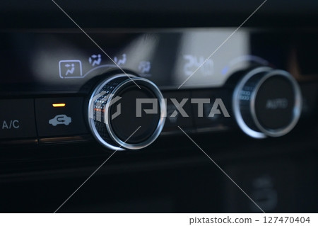 interior view of car with black leather, closeup car air conditional control interior view of car with black leather, closeup car air conditional control 127470404