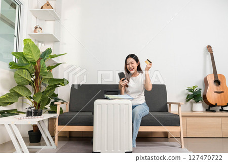 Travel Excitement with Smartphone and Credit Card. Woman ready for booking her next trip. Travel Excitement with Smartphone and Credit Card. Woman ready for booking her next trip. 127470722