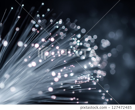 Futuristic optical cable glowing on dark background, information technology illustration 127472485