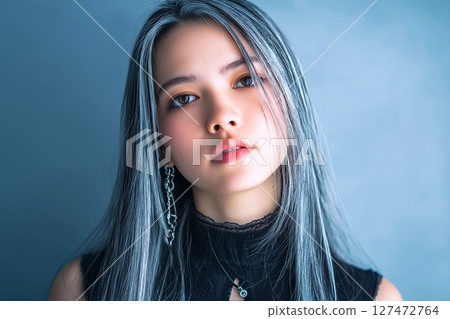 "AI-generated image" of a beautiful woman looking at the camera 127472764