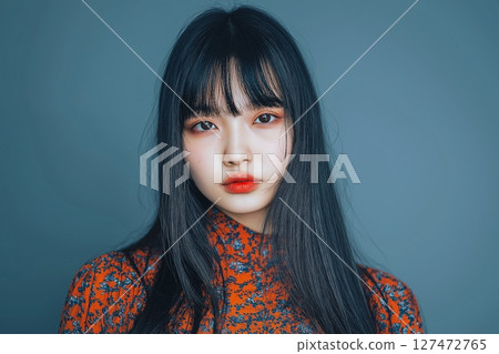 "AI-generated image" of a beautiful woman looking at the camera 127472765