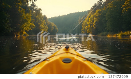 Kayaking on a River Surrounded by Green Forest Kayaking on a River Surrounded by Green Forest 127472999
