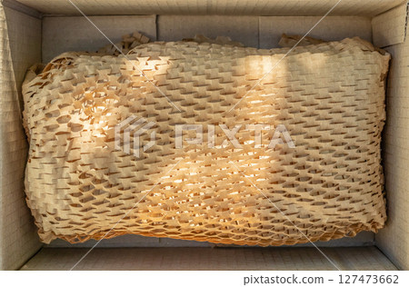 Eco friendly brown paper honeycomb wrap for product packaging parcel carton box Eco friendly brown paper honeycomb wrap for product packaging parcel carton box 127473662