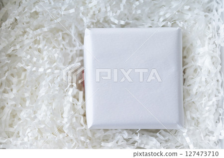 Eco friendly white paper wrap for product packaging parcel carton box 127473710