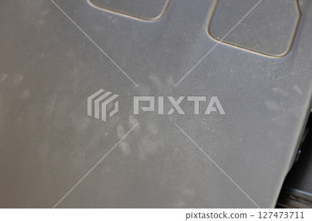 Rat footprint in the car engine 127473711