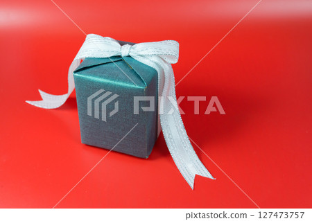 minimal flat lay chinese new year decoration item and gift box on red background 127473757
