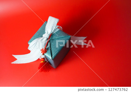 minimal flat lay chinese new year decoration item and gift box on red background 127473762
