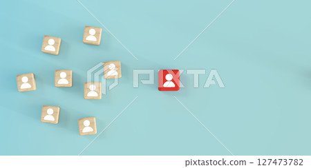Leadership, standing out from the crowd, personal branding, or recruitment strategy. One standout red block among many wooden blocks with people icons on pastel background. Symbolizing individuality. 127473782