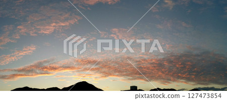 Summer clouds in sunset time 127473854